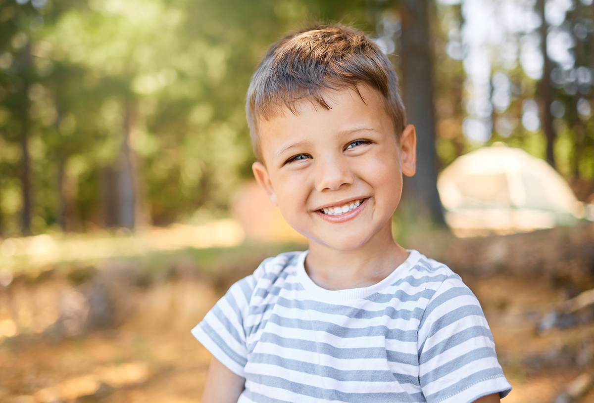 Happy young boy smiling outdoors in the Mississippi Delta